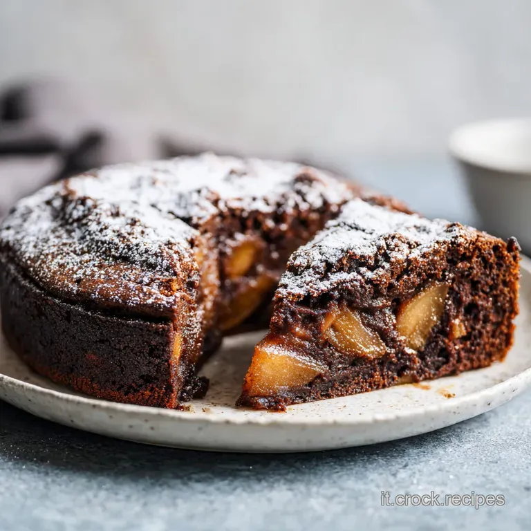 A slice of moist chocolate apple cake on a white plate, dusted with sugar, next to a fork ready to be served. Comforting d...